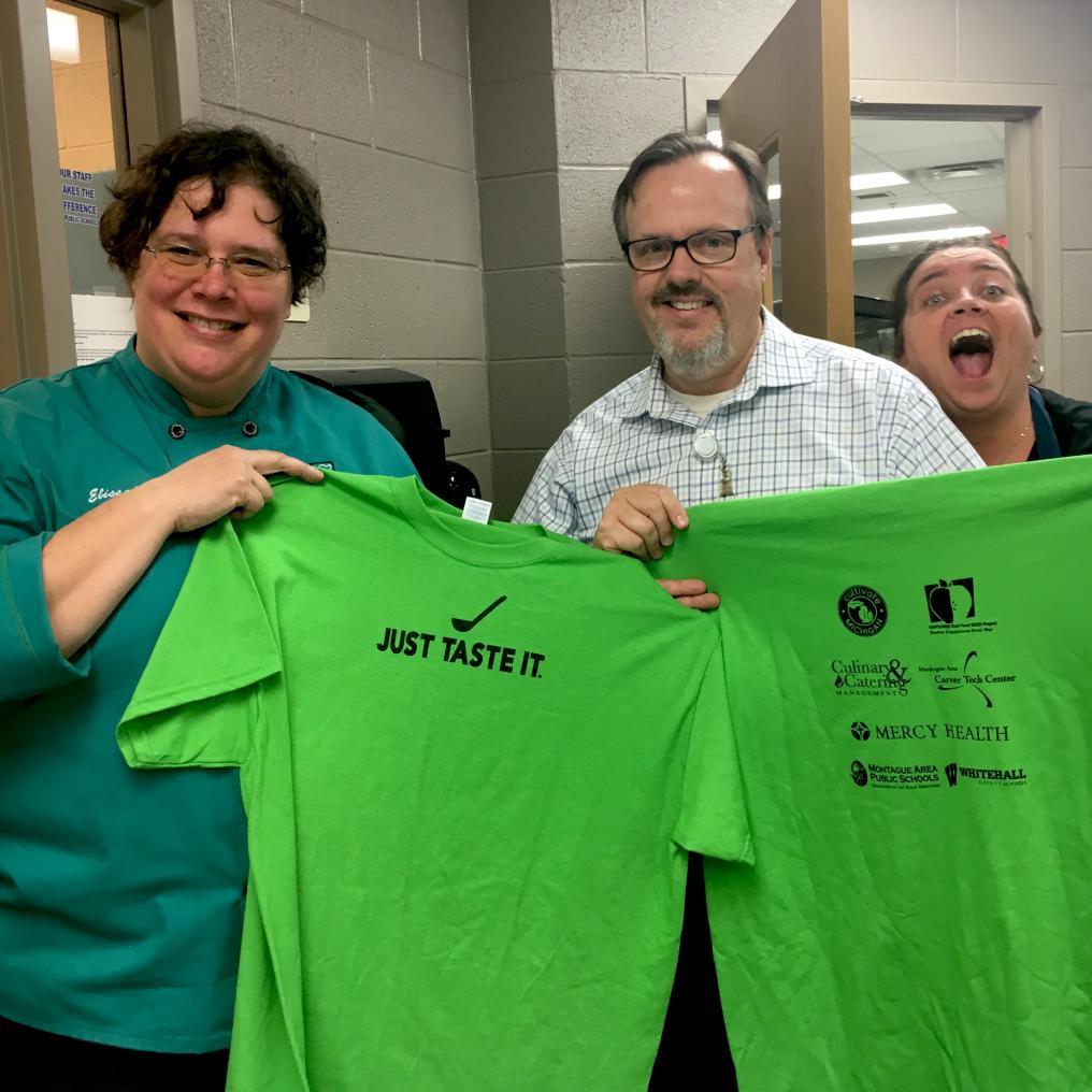 Dan Gorman and colleagues show off the Just Taste It t-shirts!